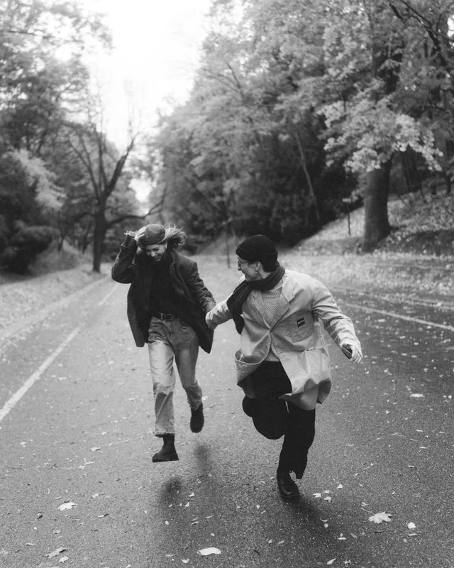 Black and white: Sergei and Elvira running down an alley of trees